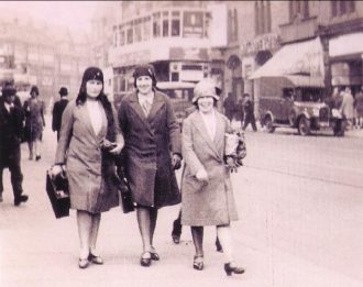 Three Castleford lasses going to work at Sheeny Park tailoring factory in Leeds, 1920