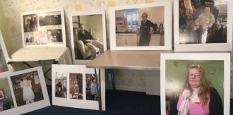 Exhibition photos informally mounted on the wall | 100 Homes Project