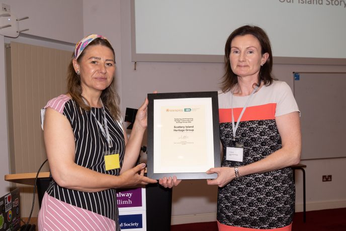 Audrey Wilson of CAHG with Eve Brennan, Scattery Island Heritage Group, winner of the Gathering and Preserving Heritage award, 2022. | Copyright Boyd Challenger